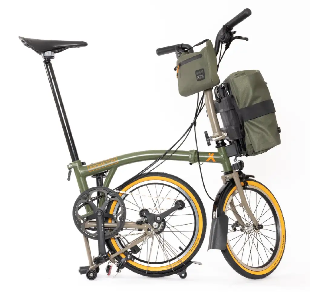 Side view of new &quot;Brompton Beyond&quot; with folded rear wheel and matching olive green bags