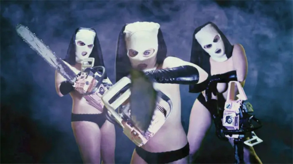 Three chainsaw-wielding nuns