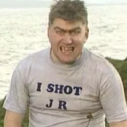 screencap of Tom in &quot;I shot JR&quot; t-shirt from the TV show Father Ted