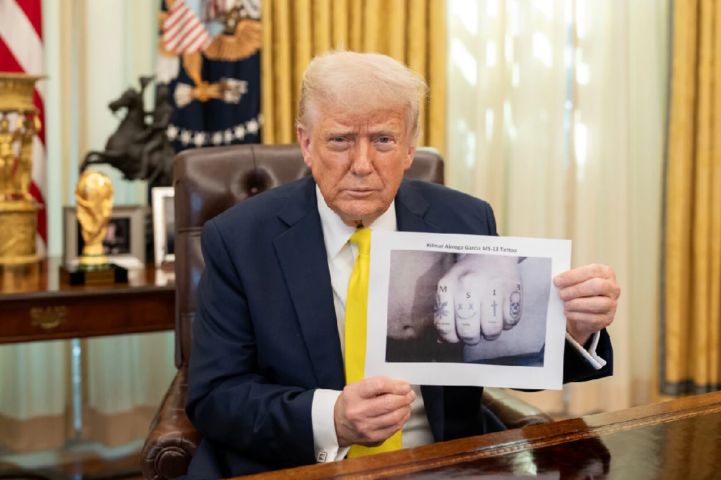 The picture posted by donal trump of himself holding a clearly poorly photoshopped picture of a hand with &quot;MS 13&quot; written, visibly edited with microsoft paint