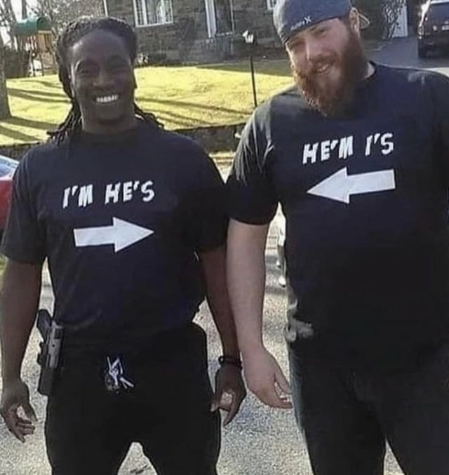 Couple wearing shirts that say &quot;I&#39;m he&#39;s&quot; and &quot;he&#39;m I&#39;s&quot;