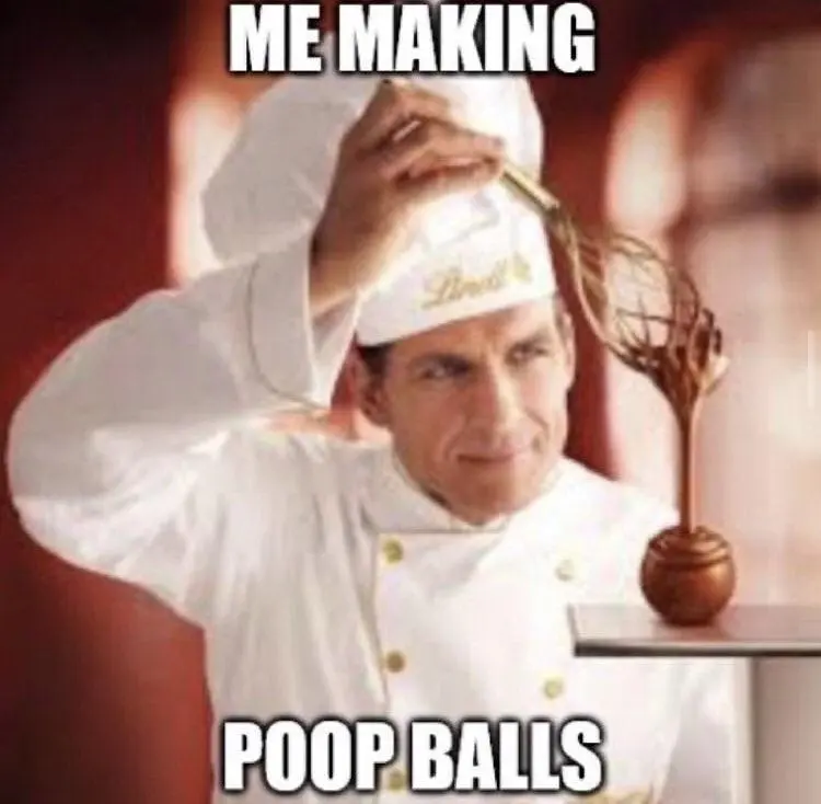 An image of a chocalatier drizzling chocolate onto a Lindt chocolate ball, identical to the OP but with impact font text overlaid reading &quot;ME MAKING POOP BALLS&quot;
