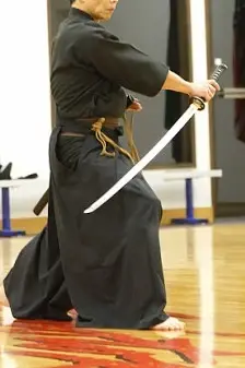 Cool guy holding a sword backwards