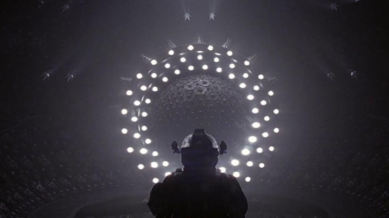 Foreboding, dark sphere surrounded by a concentric ring of lights, from the 1997 horror movie Event Horizon